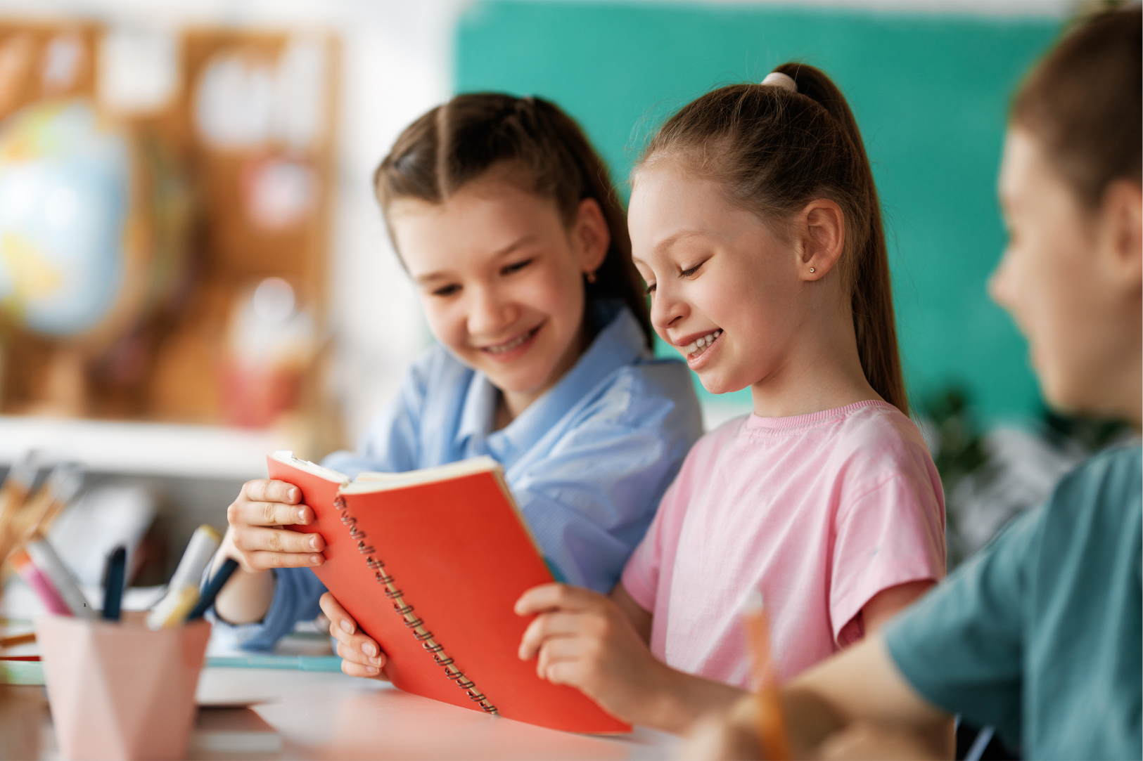 Children learning together with a tutor